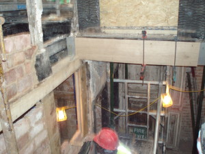 After carefully replacing the framed oak walls The Stone Masons Bricking in between . 